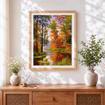 Finished autumn forest river cross stitch artwork displayed