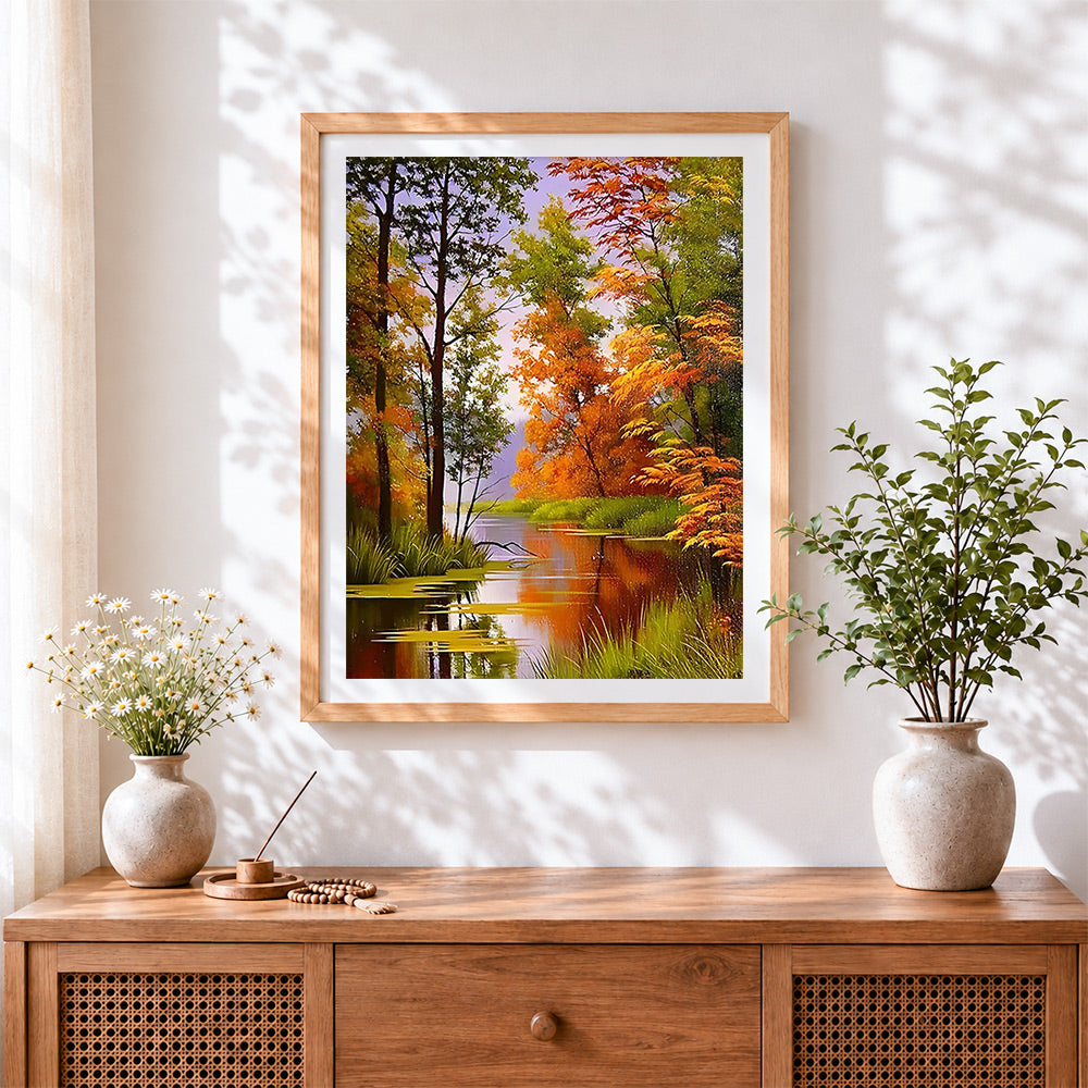 Finished autumn forest river cross stitch artwork displayed