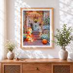 Finished autumn front porch with pumpkins and cornstalks cross stitch artwork displayed
