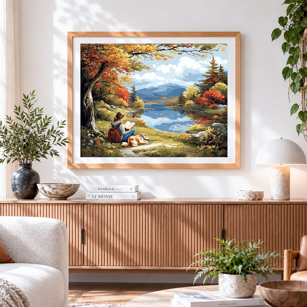 Finished autumn lakeside reading paint by numbers artwork displayed as home decor