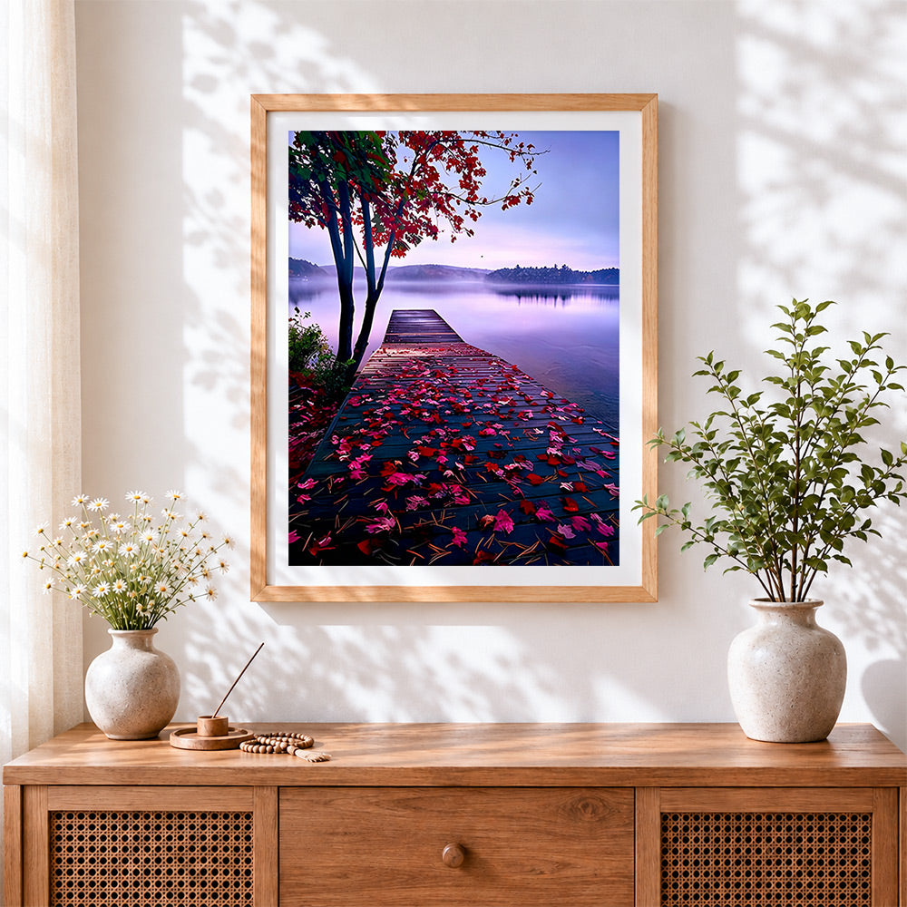 Finished autumn leaves on a lake pier cross stitch artwork displayed