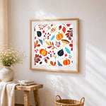 Autumn leaves pumpkins and berries pattern cross stitch artwork displayed on wall as home decor