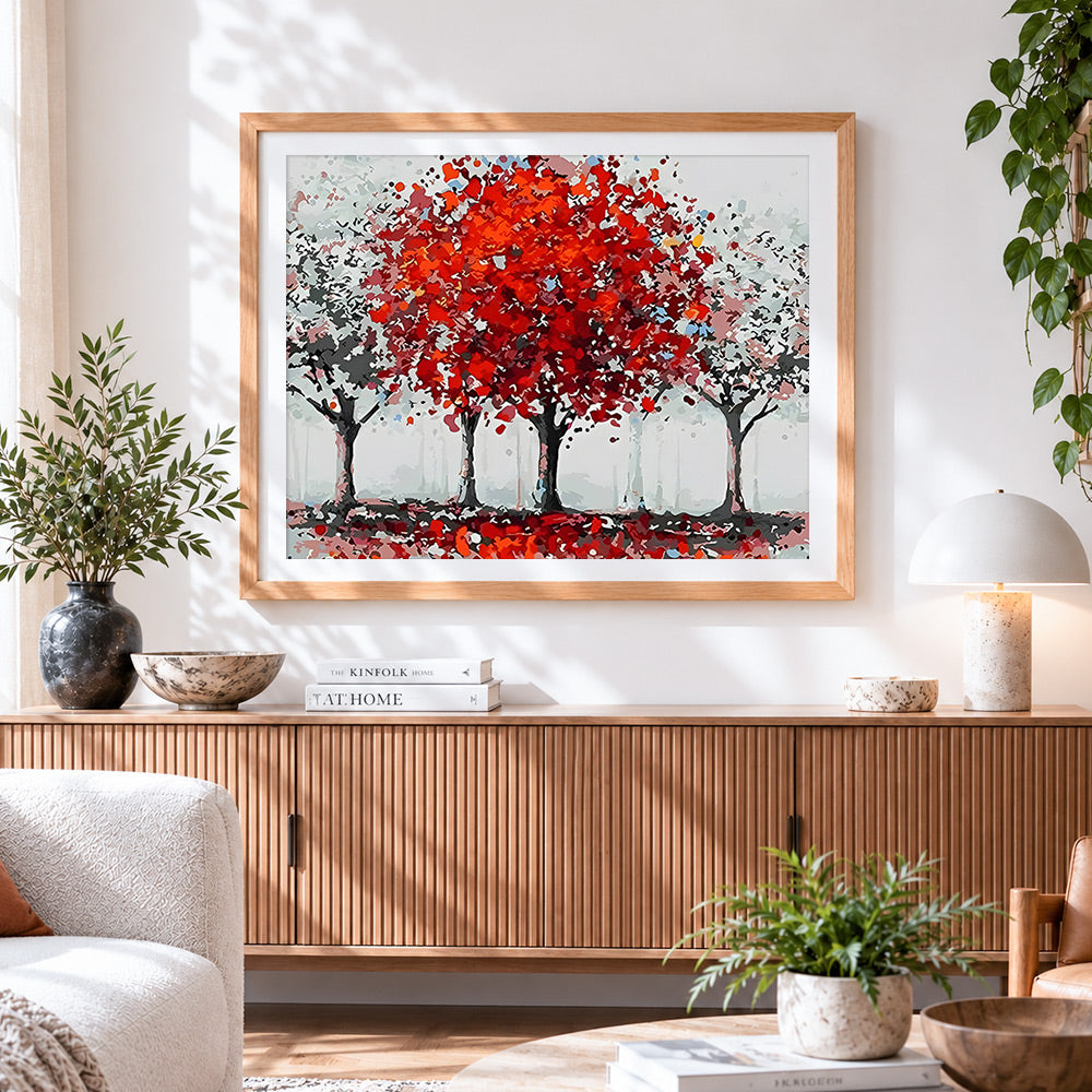 Finished autumn red trees cross stitch artwork displayed
