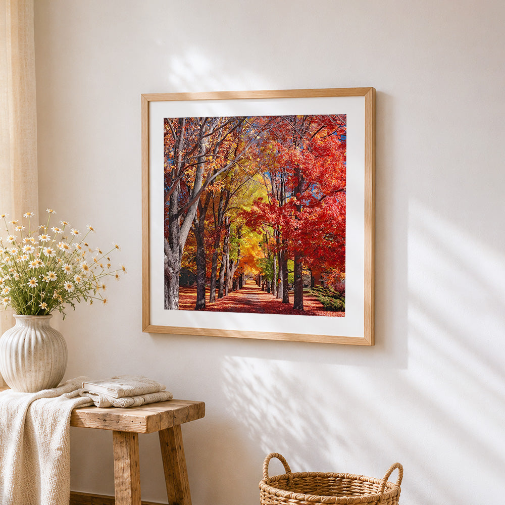 Autumn tree lined avenue cross stitch artwork displayed on wall as home decor
