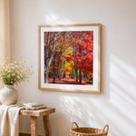 Autumn tree lined avenue cross stitch artwork displayed on wall as home decor
