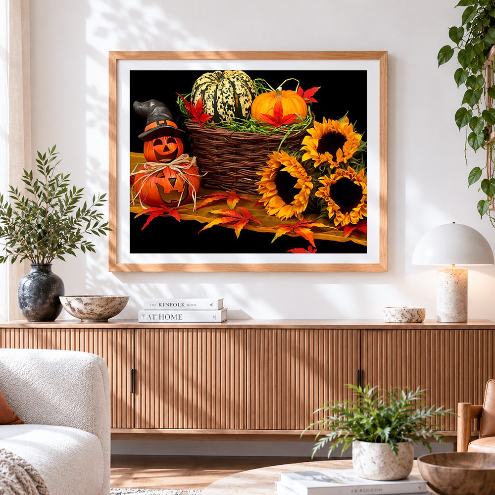 Finished autumnal pumpkin and sunflower still life cross stitch artwork displayed