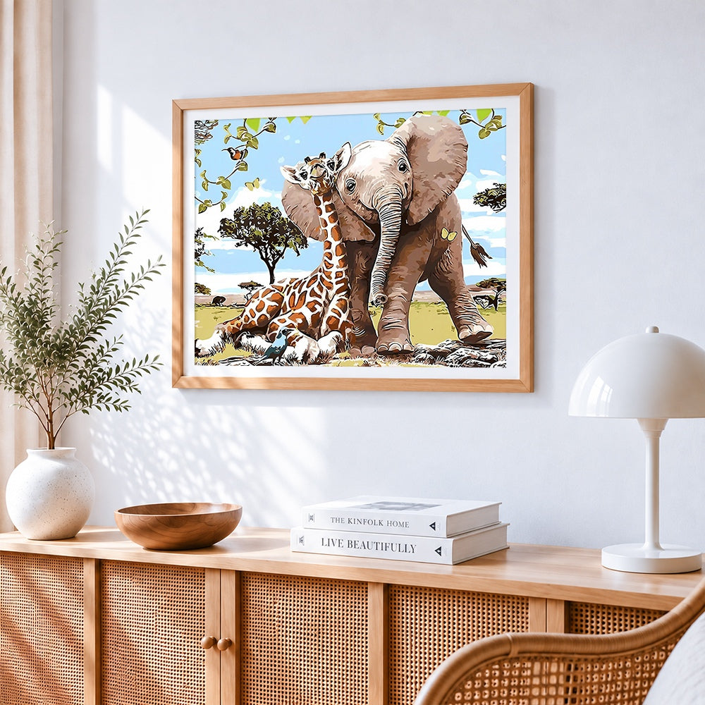 Baby elephant and giraffe cross stitch artwork displayed on wall as home decor