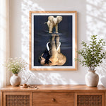 Finished baby elephant and reflection cross stitch artwork displayed
