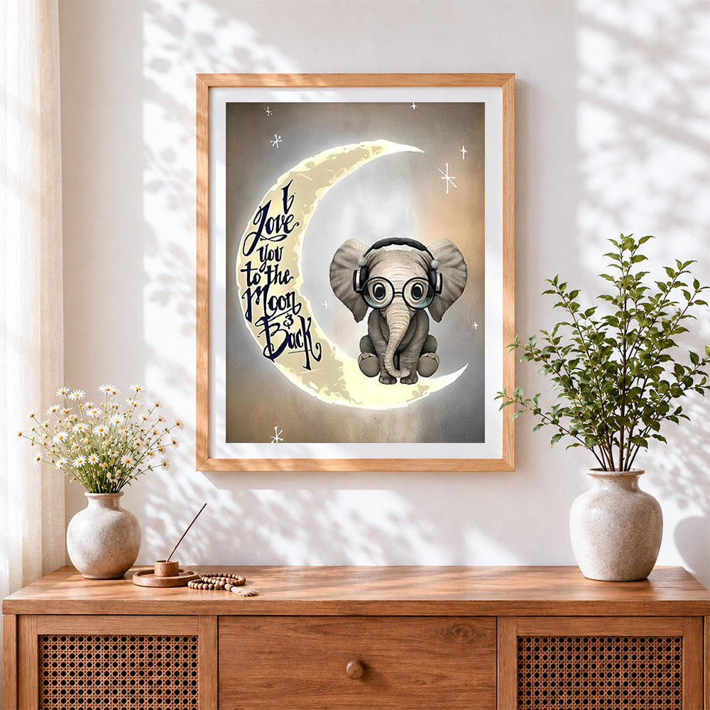 Finished baby elephant on the moon cross stitch artwork displayed
