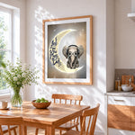Baby elephant on the moon cross stitch artwork displayed on wall as home decor