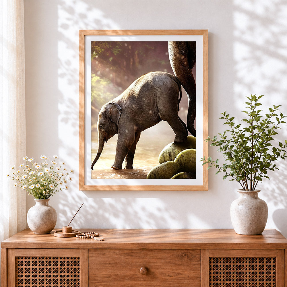 Finished baby elephant with mother cross stitch artwork displayed