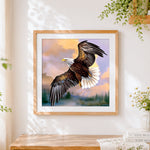 Finished bald eagle flying at sunset cross stitch artwork displayed