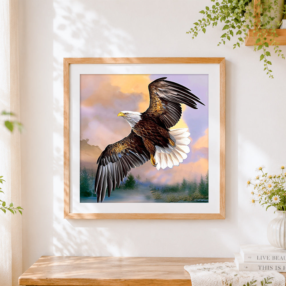 Finished bald eagle flying at sunset cross stitch artwork displayed