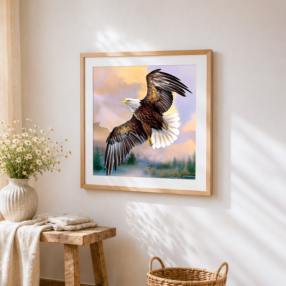 Bald eagle flying at sunset cross stitch artwork displayed on wall as home decor