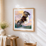 Bald eagle flying at sunset cross stitch artwork displayed on wall as home decor