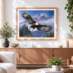 Finished bald eagle flying over snowy mountains cross stitch artwork displayed
