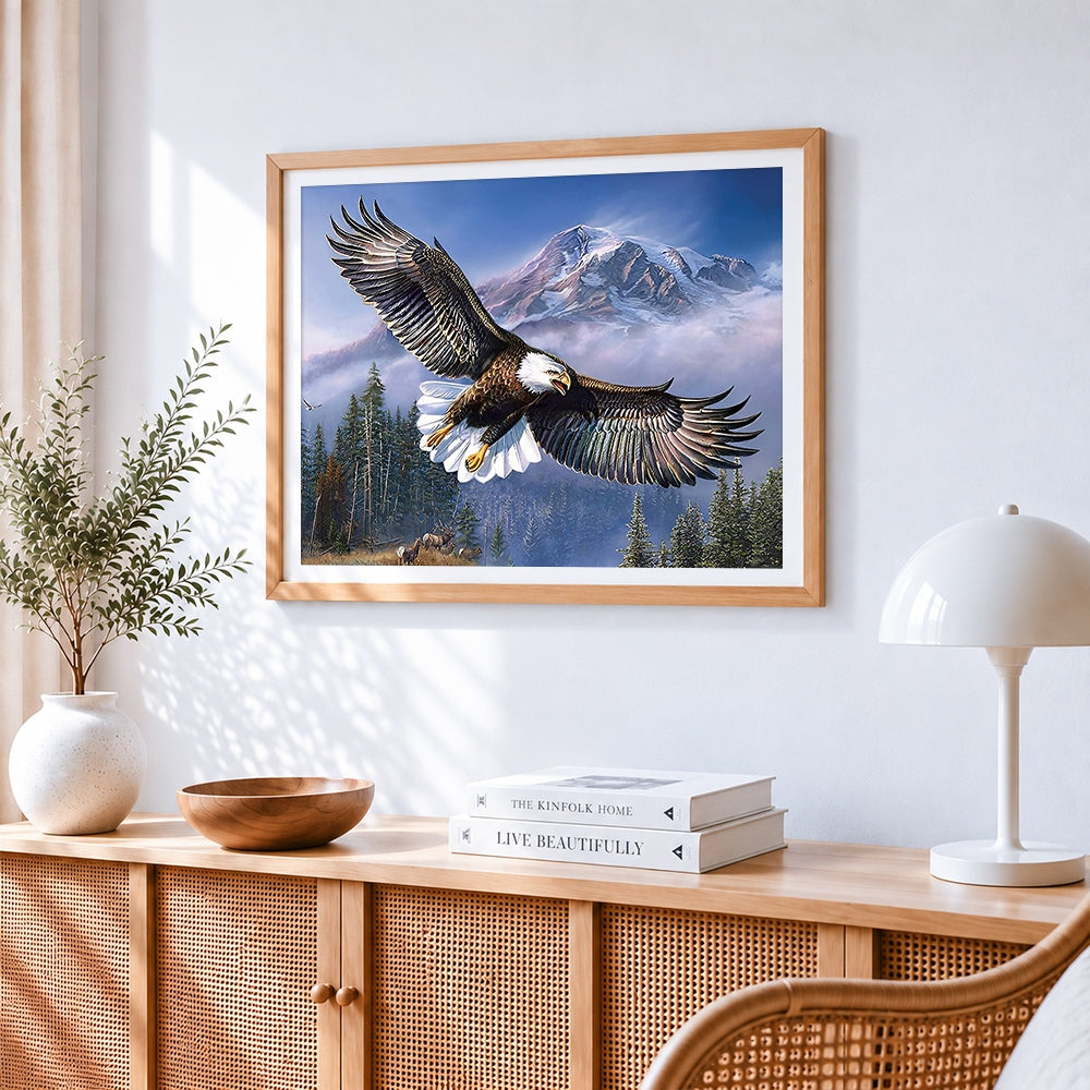 Bald eagle flying over snowy mountains paint by numbers artwork displayed on wall as home decor