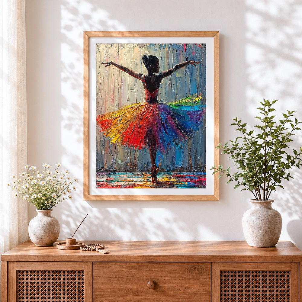 Finished ballerina with rainbow tutu cross stitch artwork displayed