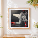 Finished ballerina with red ballet shoes cross stitch artwork displayed