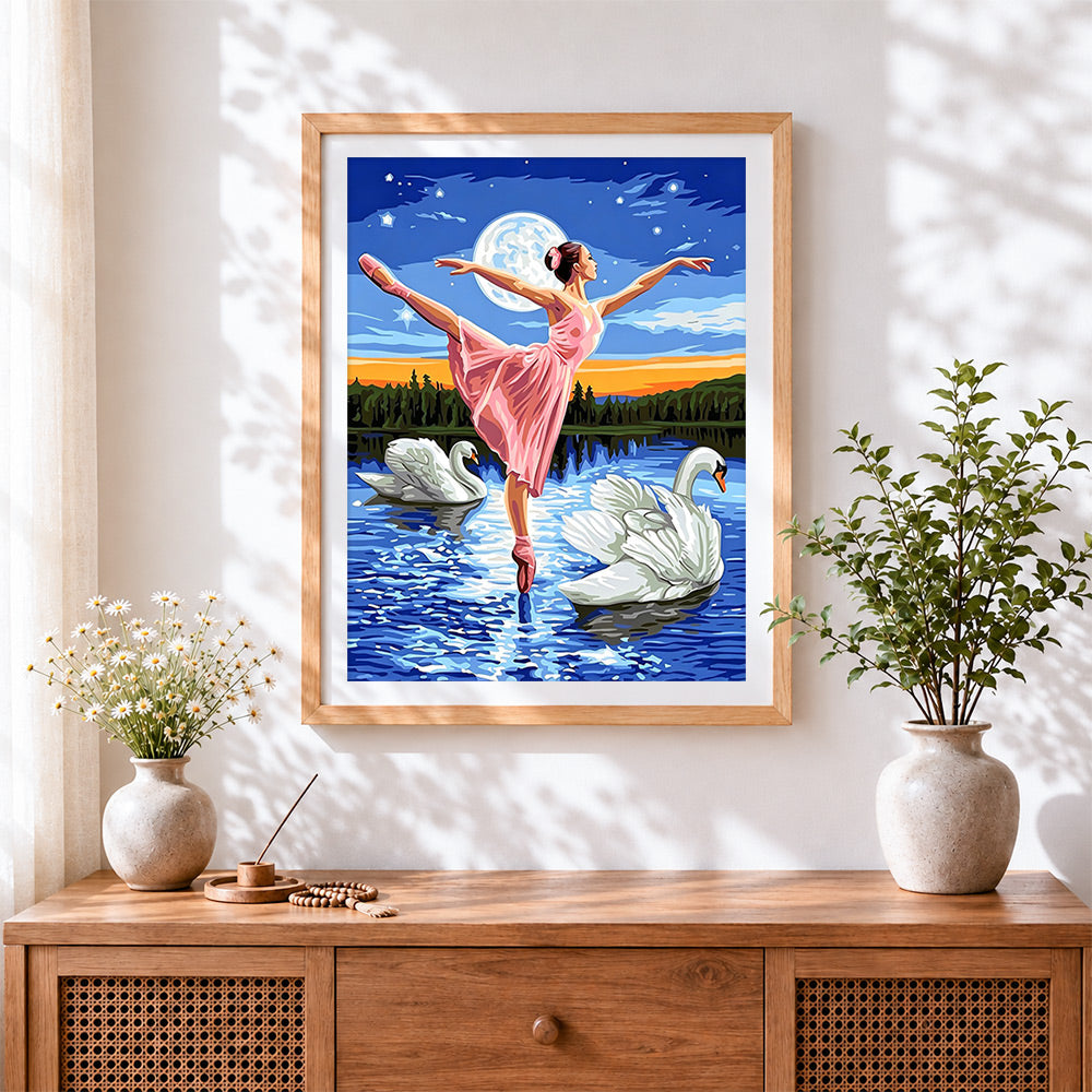 Finished ballerina with swans at moonlight cross stitch artwork displayed