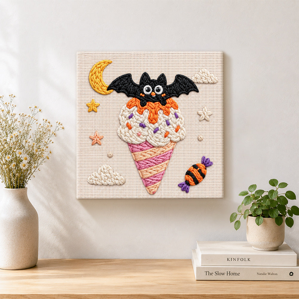 Finished bat moon ice cream punch needle artwork displayed on a table