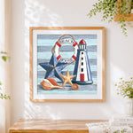 Finished beach house still life cross stitch artwork displayed