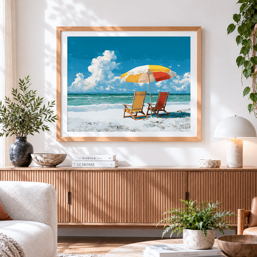Finished beach parasol and chairs cross stitch artwork displayed