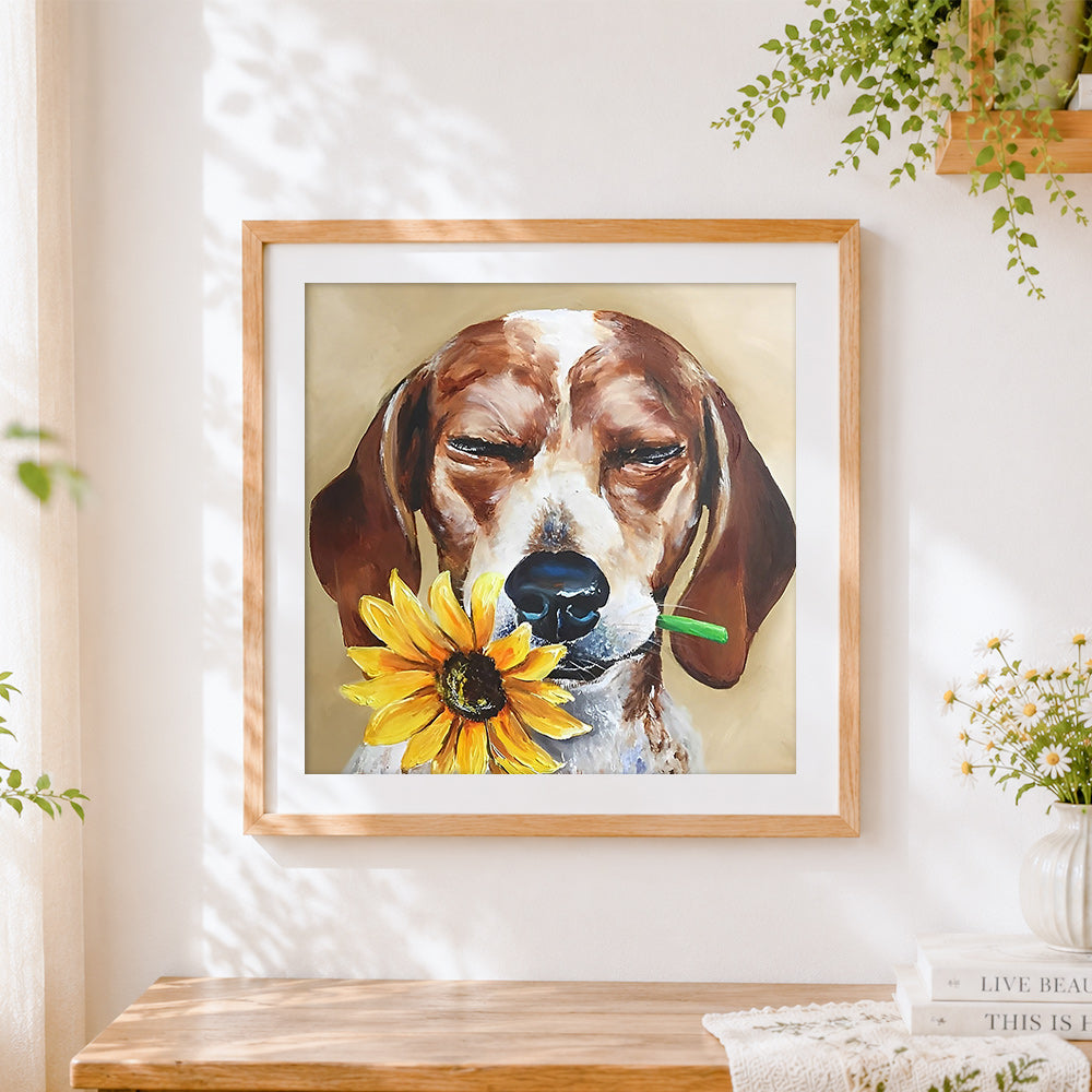 Finished beagle with a sunflower cross stitch artwork displayed