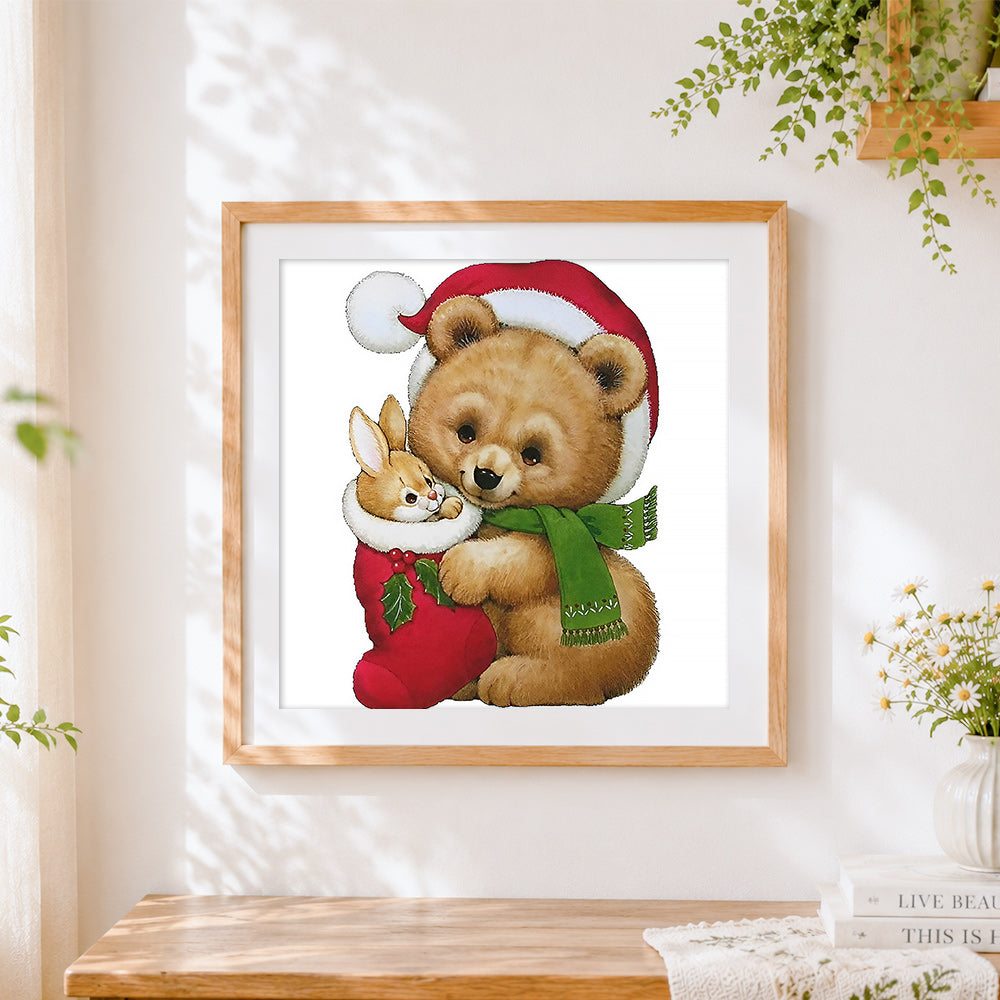 Finished bear and bunny in christmas stocking cross stitch artwork displayed