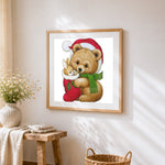 Bear and bunny in christmas stocking cross stitch artwork displayed on wall as home decor