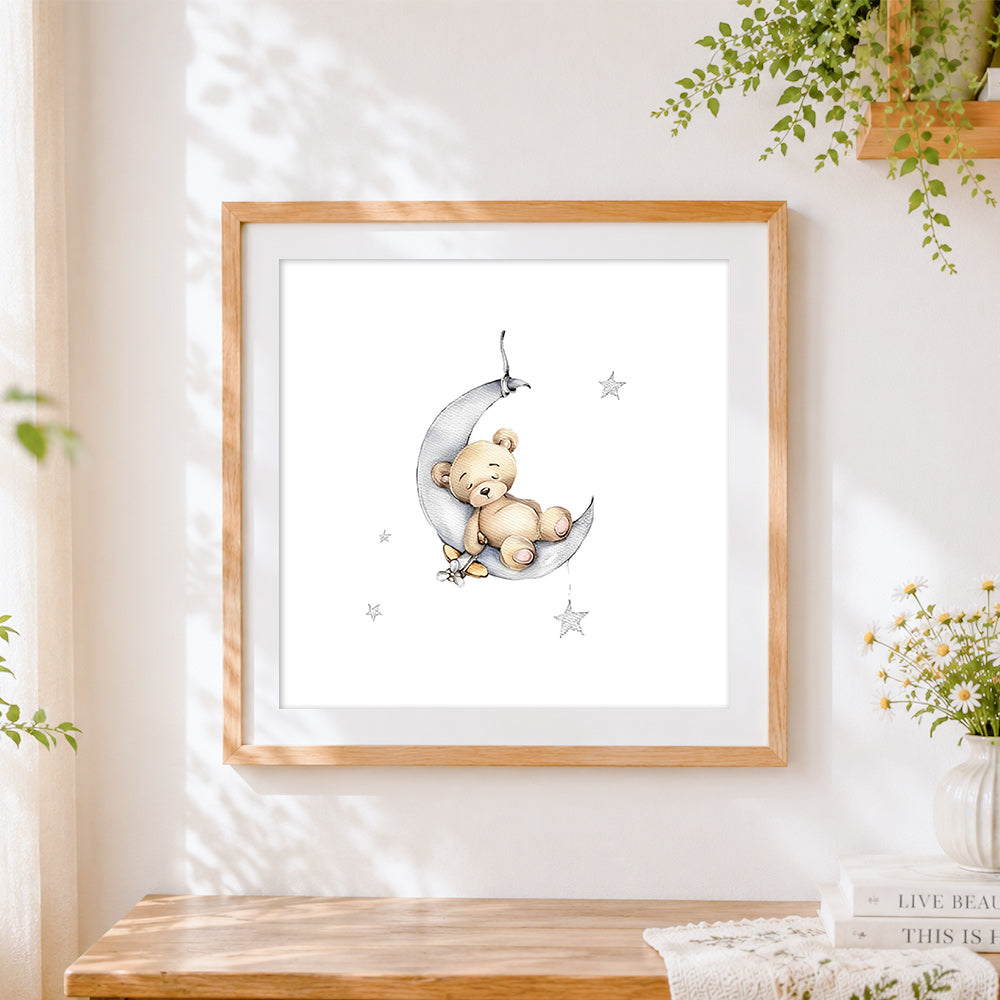 Finished bear sleeping on the moon cross stitch artwork displayed