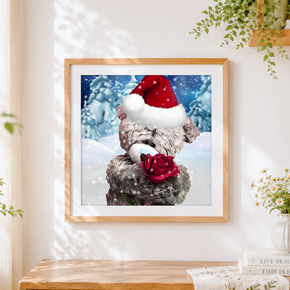Finished bear with red rose in snow cross stitch artwork displayed