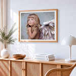 Beautiful little angel with white wings cross stitch artwork displayed on wall as home decor