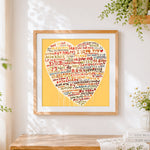 Finished beige multi language i love you heart cross stitch artwork displayed