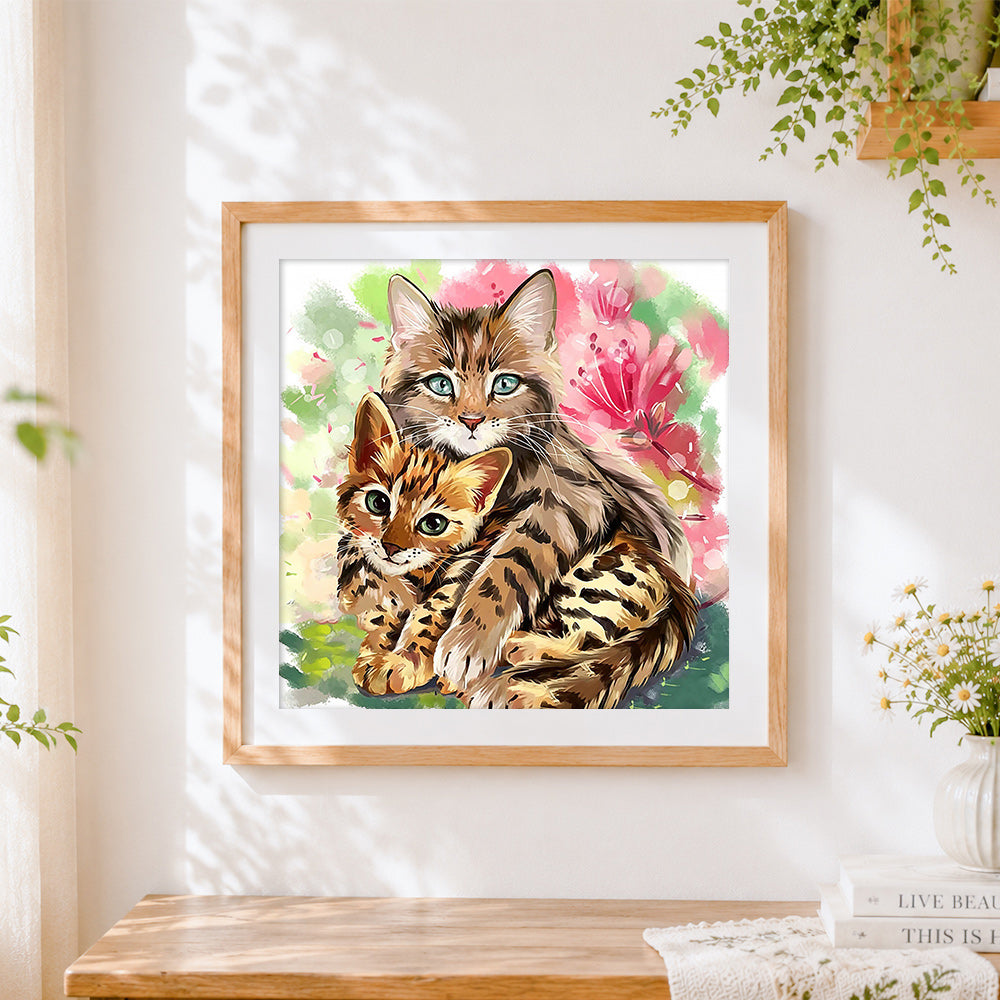 Finished bengal cat and kitten cross stitch artwork displayed