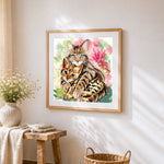 Bengal cat and kitten cross stitch artwork displayed on wall as home decor