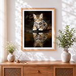 Finished bengal kitten and water reflection cross stitch artwork displayed