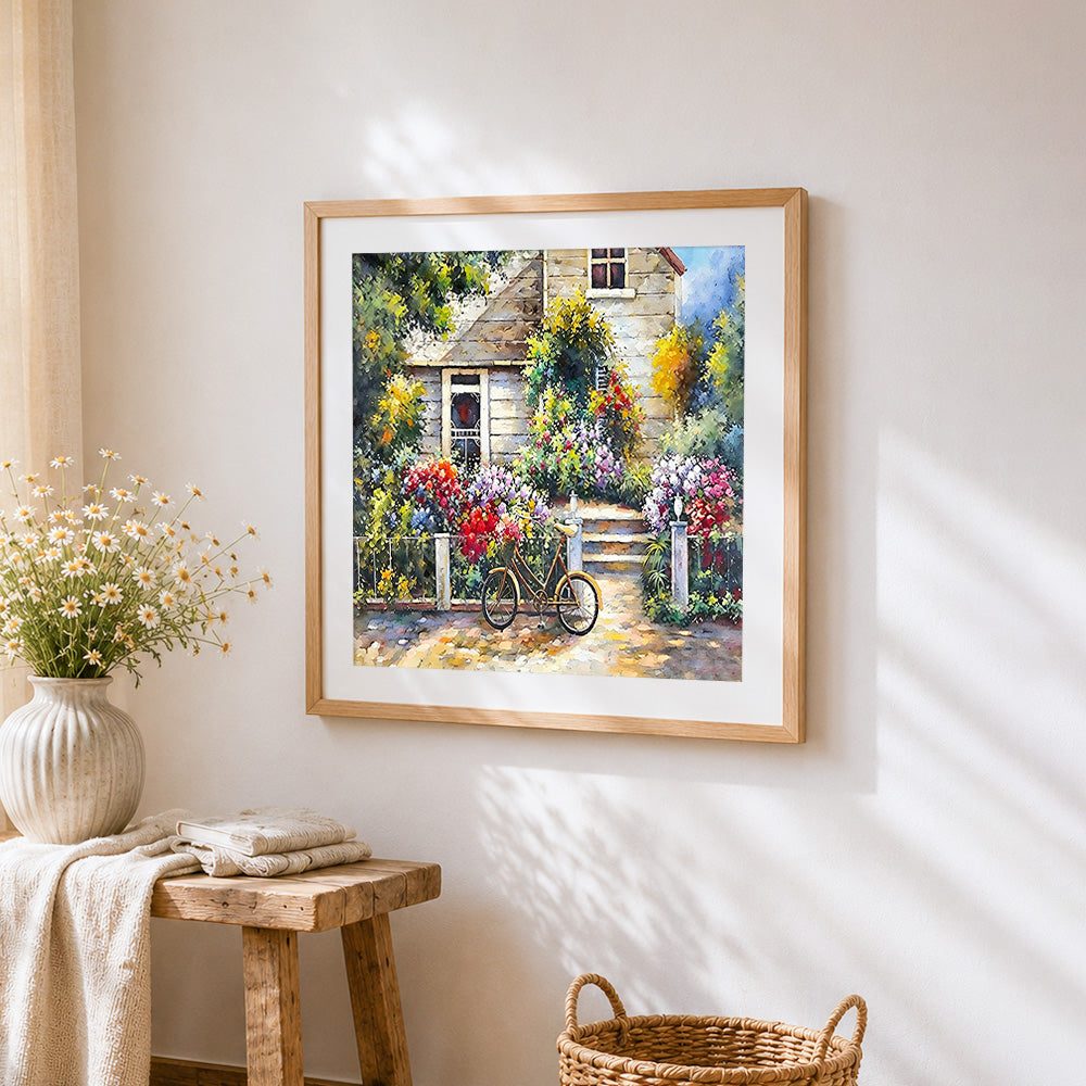 Bicycle in the cottage garden cross stitch artwork displayed on wall as home decor