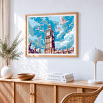 Big ben and flying doves cross stitch artwork displayed on wall as home decor