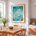 Bird and butterfly on blossom branch cross stitch artwork displayed on wall as home decor