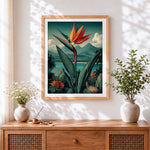 Finished bird of paradise and tropical landscape cross stitch artwork displayed