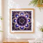 Finished black and purple mandala cross stitch artwork displayed
