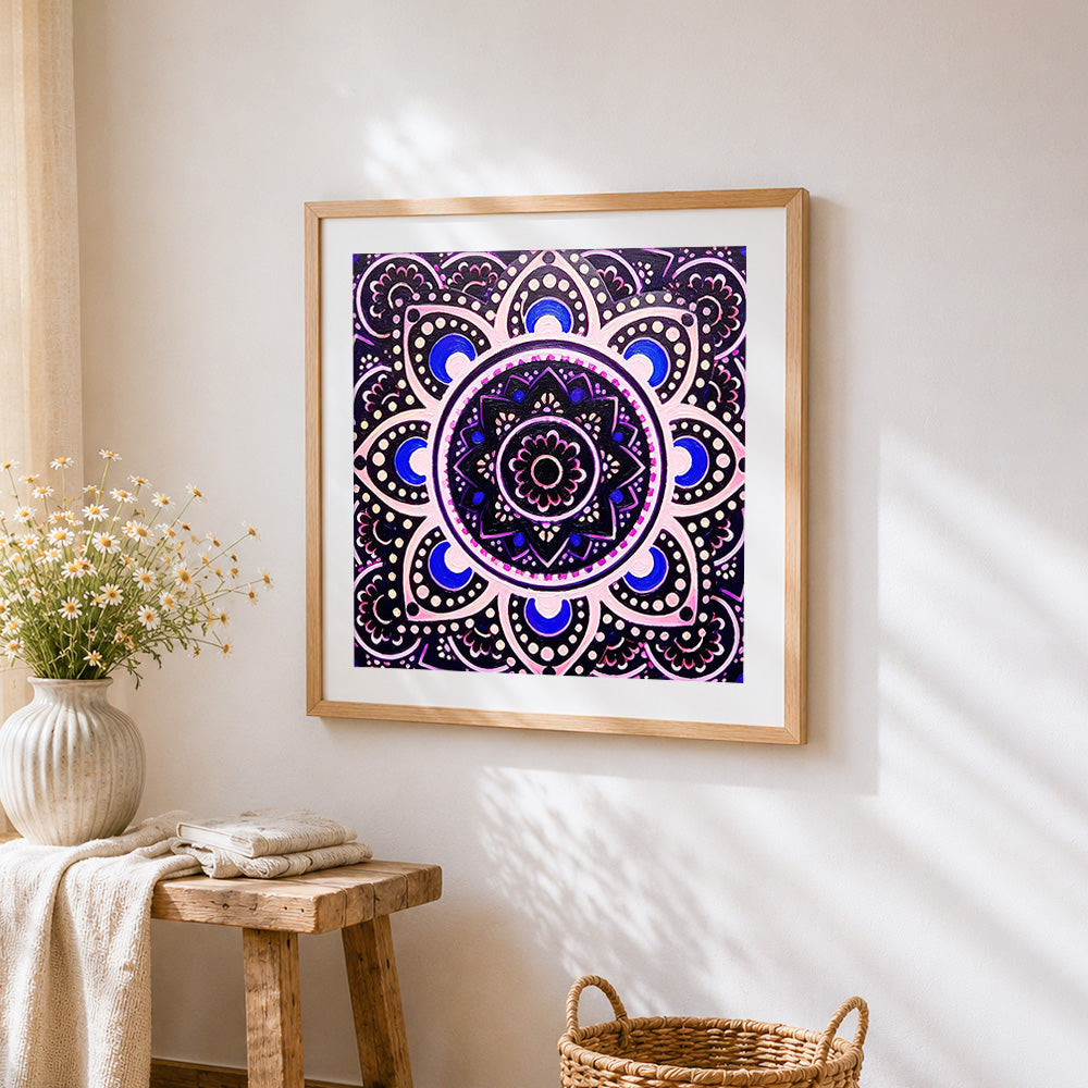 Black and purple mandala cross stitch artwork displayed on wall as home decor