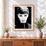 Finished black and white audrey hepburn portrait cross stitch artwork displayed