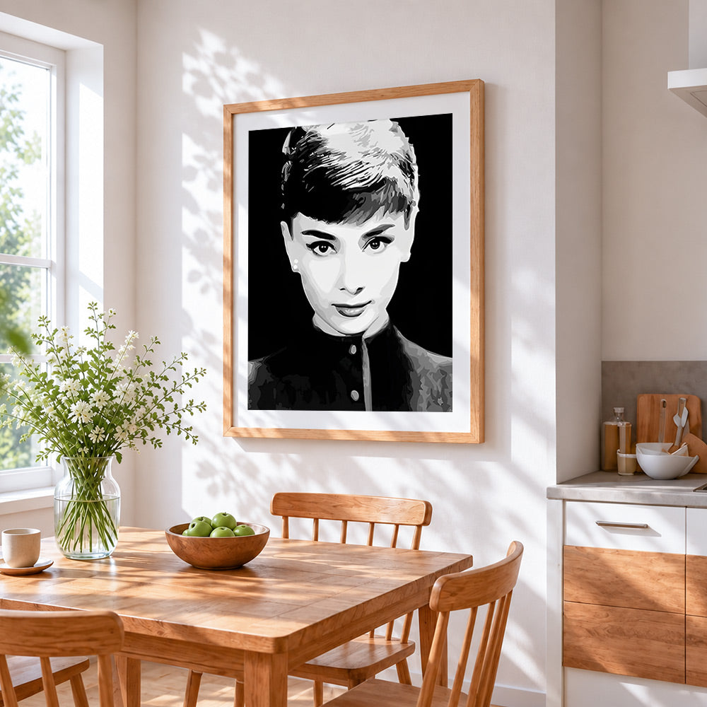 Black and white audrey hepburn portrait cross stitch artwork displayed on wall as home decor