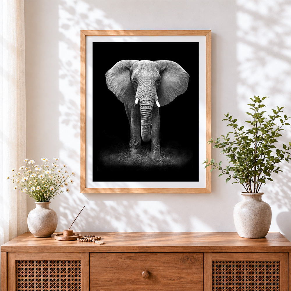 Finished black and white elephant portrait cross stitch artwork displayed