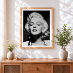 Finished black and white marilyn monroe portrait cross stitch artwork displayed