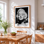 Black and white marilyn monroe portrait cross stitch artwork displayed on wall as home decor