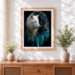 Finished black and white wolves in dreamcatcher cross stitch artwork displayed