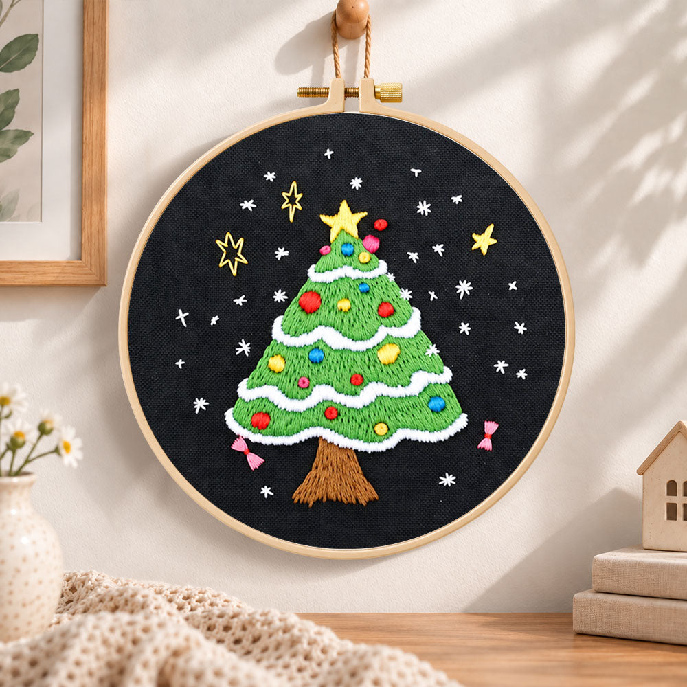 Black background tree embroidery hoop wall art displayed as warm and cosy handmade home decor